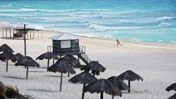 A lone tourist enjoys the beach in Cancun, Quintana Roo state, Mexico, on March 28, 2020. - A significant drop in the number of tourists is registered in Mexico's resorts due to the novel coronavirus pandemic. (Photo by Elizabeth RUIZ / AFP) (Photo by ELIZABETH RUIZ/AFP via Getty Images)