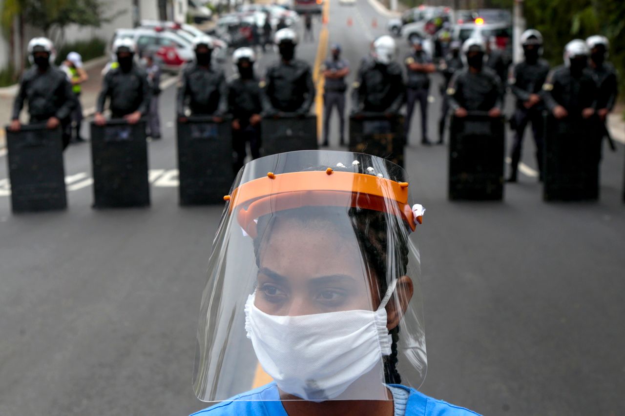 A resident of Paraisopolis, one of Sao Paulo's largest slums, takes part in a May 18 protest to demand more aid from Sao Paulo's state government.