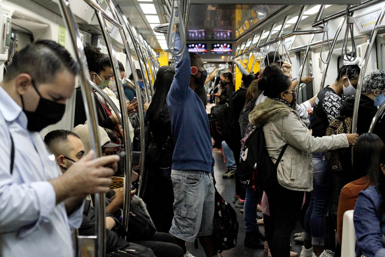 People ride on a train in Sao Paulo on May 19.
