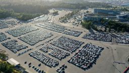 An aerial view of stationed rental cars parked at Dodger Stadium amid the coronavirus pandemic on May 20, 2020 in Los Angeles, California. With Major League Baseball's season delayed due to COVID-19 and rental cars in short demand with most travel curtailed, rental car companies have parked surplus vehicles at the lot as they have limited capacity to station them elsewhere. (Photo by Mario Tama/Getty Images)
