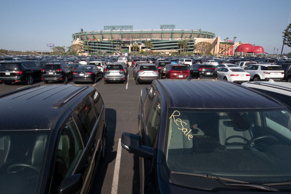 Thousands of rental cars are stored at Angel Stadium of Anaheim, a sign of the plunge in demand for rental cars.