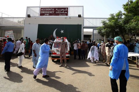 Pakistani security officials secure the premises of Jinnah Hospital in Karachi, where crash victims were brought.