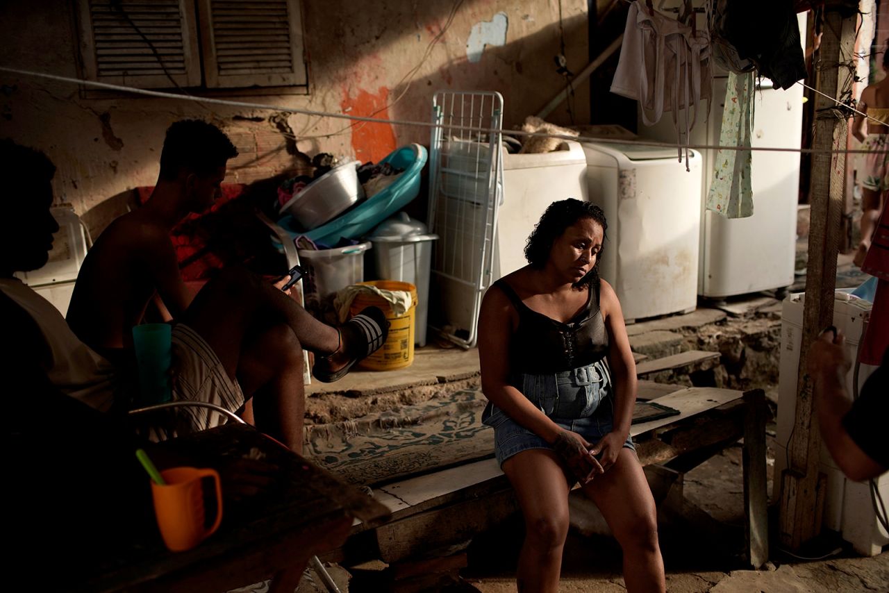 Leticia Machado, a manicurist who is jobless because of the pandemic, sits listlessly at her home in Rio on April 15.