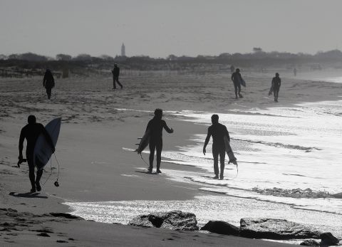 Surfers take to the water in Lido Beach, New York, on May 21.