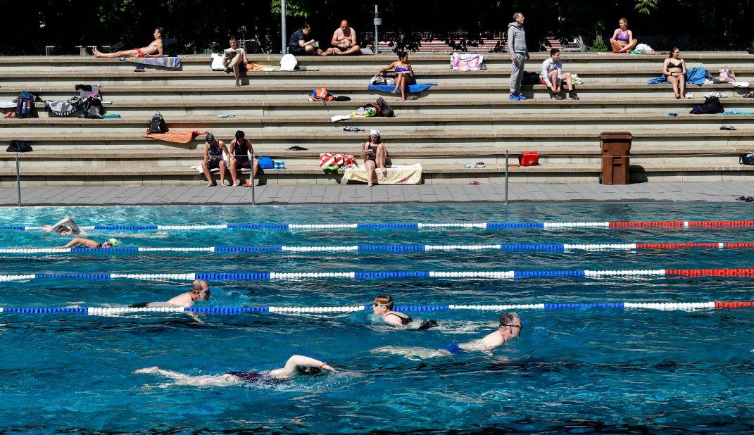 People swim at a public pool in Cologne, Germany, on May 21.