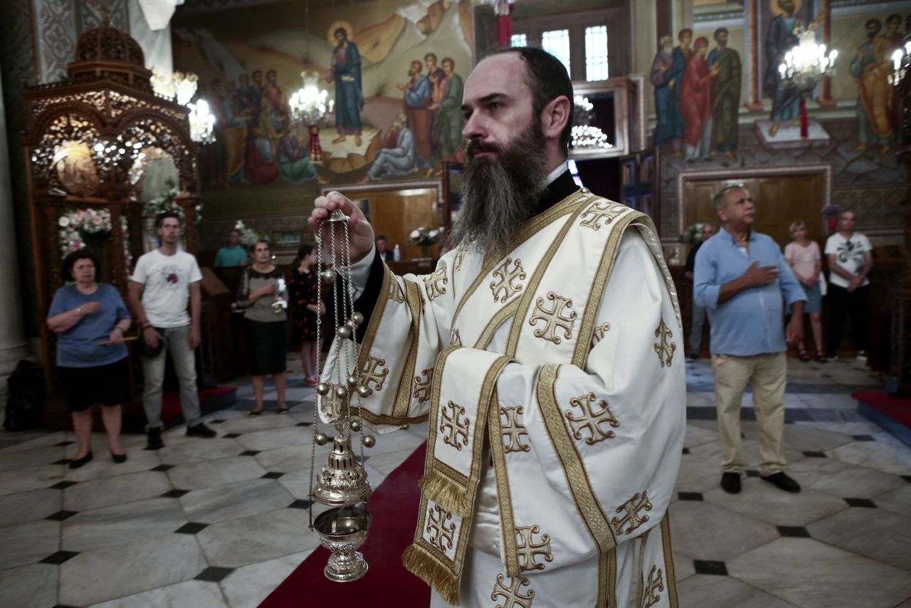 Christian Orthodox faithfuls attend a liturgy in Athens, Greece, on May 20.