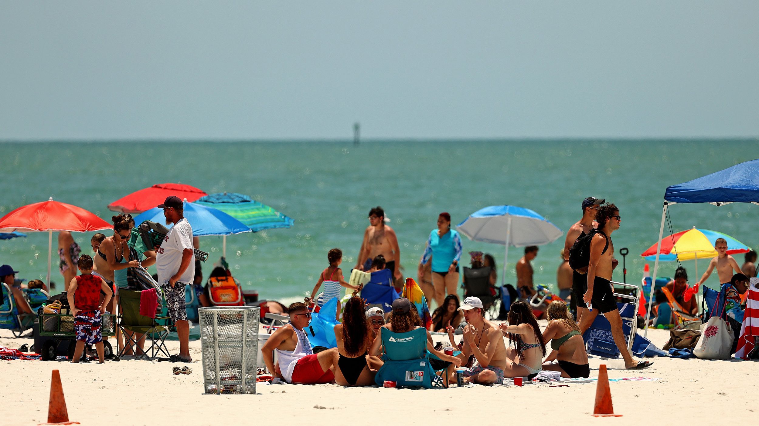 People visit Florida's Clearwater Beach on May 20. Florida opened its beaches as part of Phase One of its reopening.