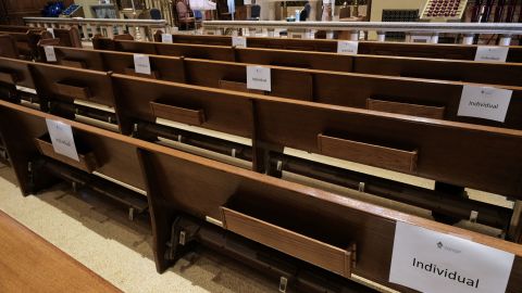 Church pews are marked with signs to allow congregants to practice social distancing. 
