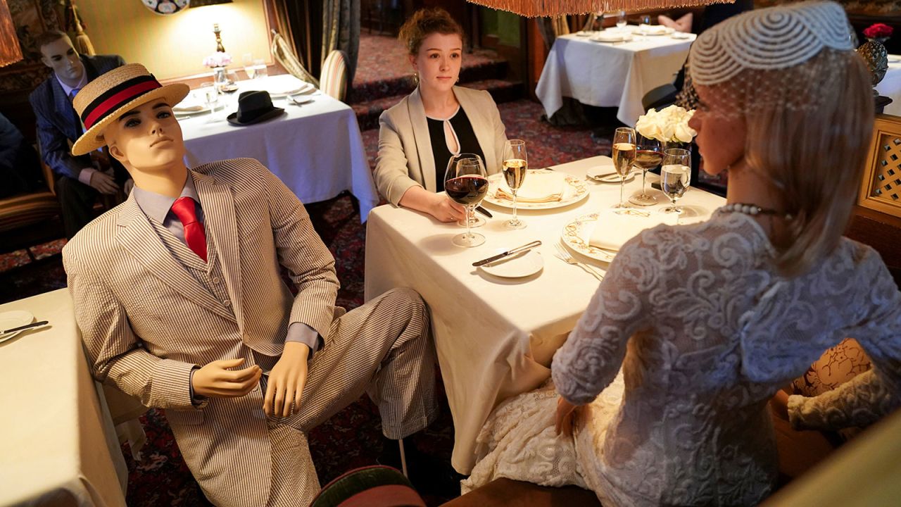 Jessie Dawson, an executive assistant for The Inn at Little Washington, is joined by mannequins as she sits in the Washington, Virginia, restaurant on May 20. The restaurant would be reopened and kept at 50% capacity for social-distancing purposes. <a href="https://www.cnn.com/travel/article/restaurant-mannequins-coronavirus-inn-washington-trnd/index.html" target="_blank">Dressed-up mannequins would be seated among diners.</a>