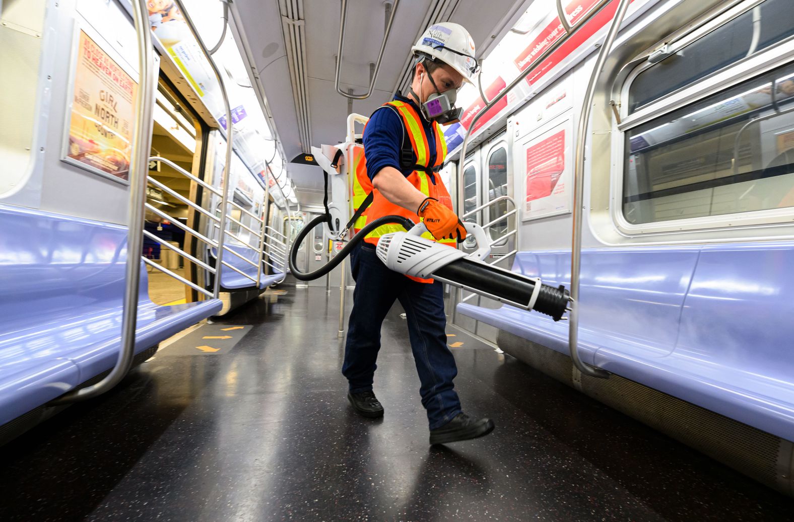 A cleaning contractor sprays disinfectant inside a New York subway car on May 23. The subway normally operates 24 hours a day, but it has been closed in the early morning hours for deep cleanings.