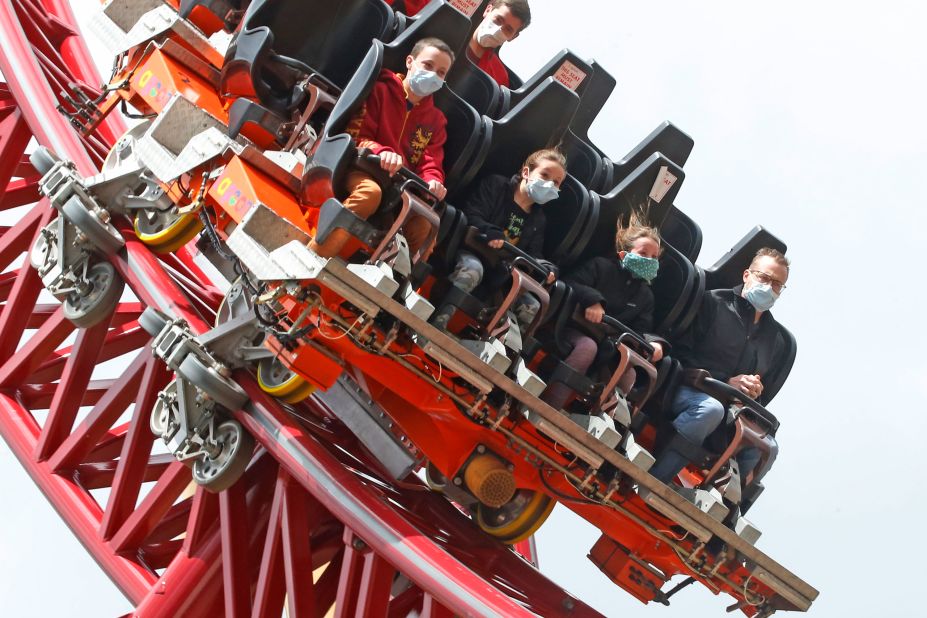 Visitors ride the Cannibal roller coaster at Lagoon Amusement Park in Farmington, Utah, on Saturday, May 23.