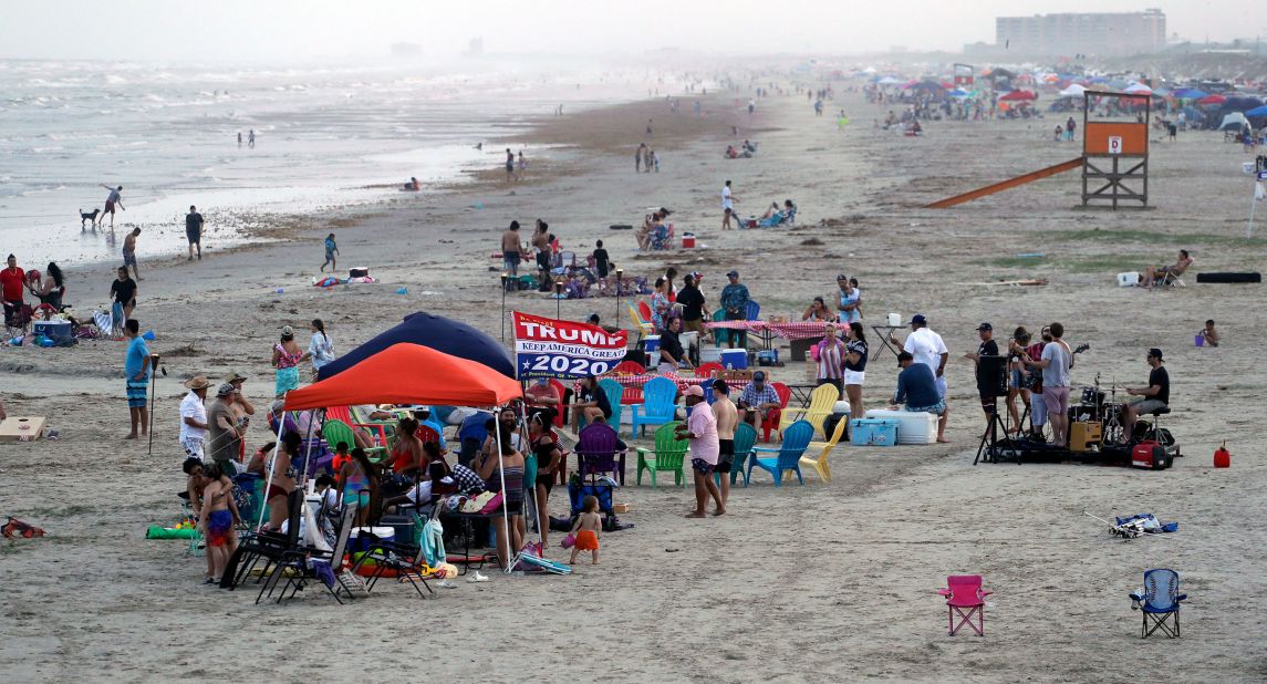 People gather on the beach in Port Aransas, Texas, on Saturday.