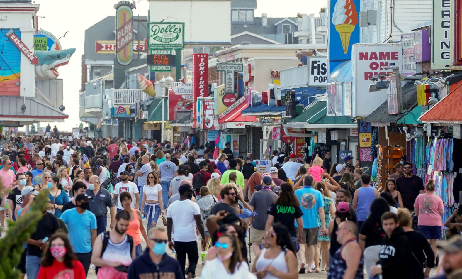People crowd the boardwalk in Ocean City, Maryland, on Saturday.