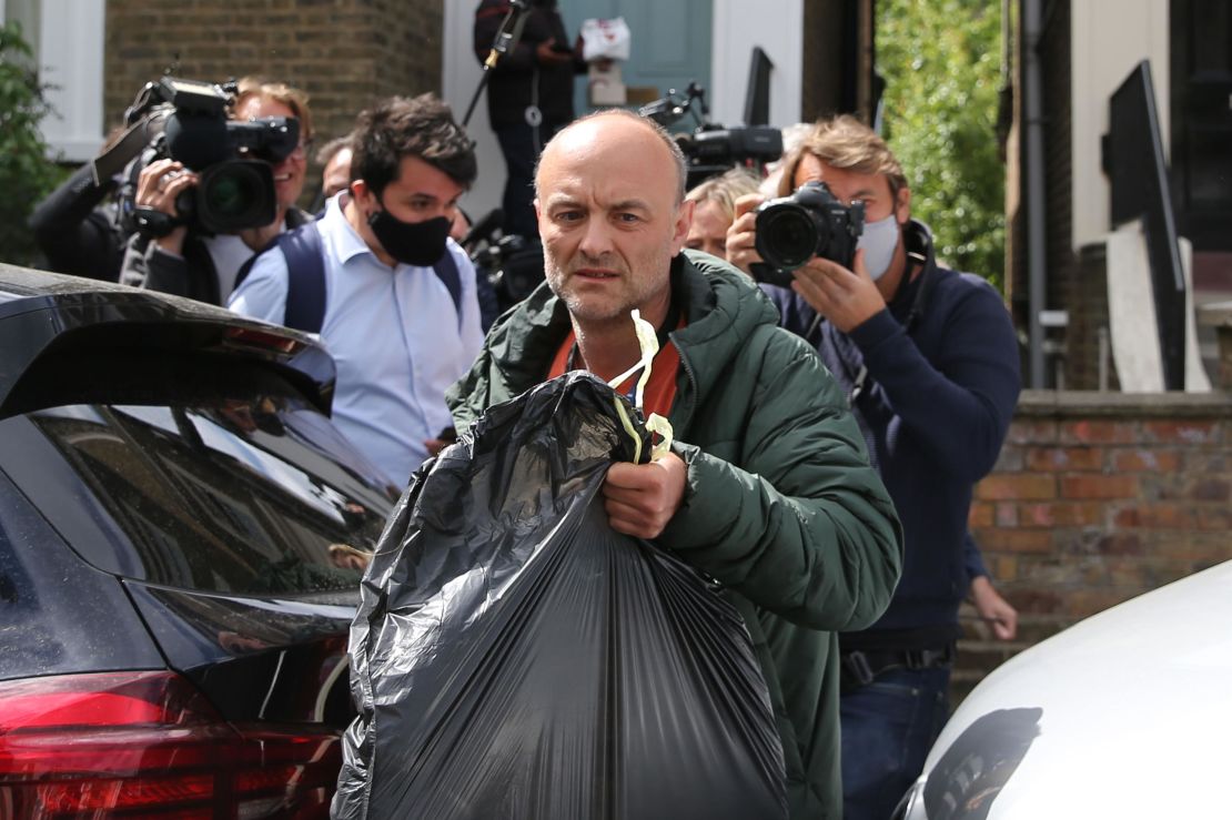 Dominic Cummings leaves his home surrounded by media in London on May 24, 2020 following allegations he broke coronavirus lockdown rules by traveling across the country in March. 