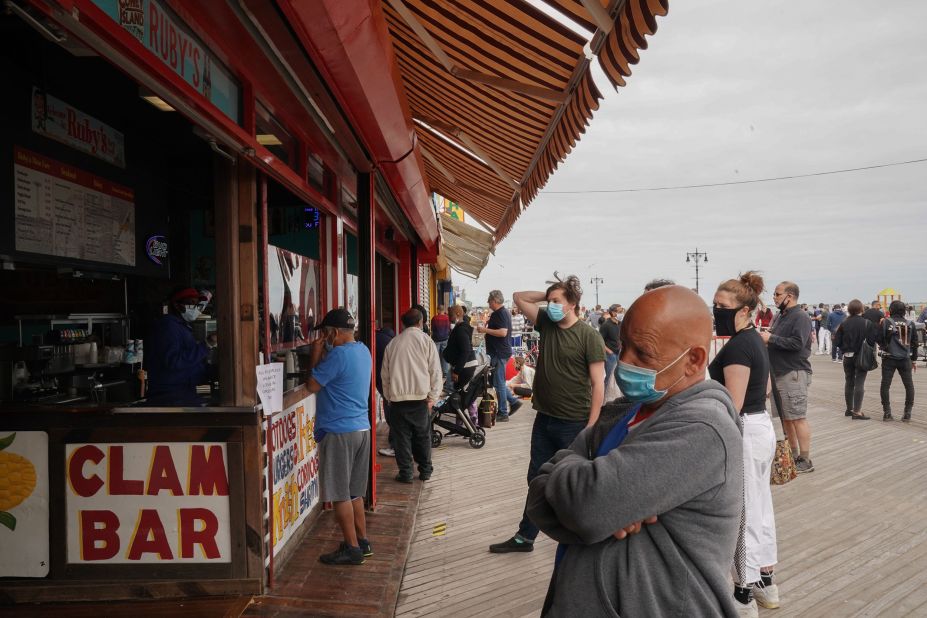 Beachgoers wait to order food at Rubys Bar and Grill at the Coney Island boardwalk in New York on Sunday.