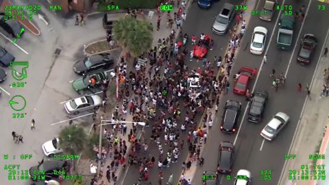 Aerial footage from the Volusia County Sheriff's Office shows large crowds blocking the streets in Daytona Beach.