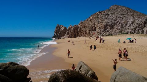 Tourists sunbathe at the "Love Beach" in Los Cabos, Baja California Sur state, Mexico in March, 2018. 