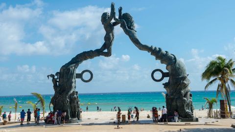 The monument to humanity, a bronze statue titled Portal Maya (Mayan Gateway), at the plaza in Playa del Carmen near Cancun in the state of Quintana Roo, Mexico, is a popular tourist attraction.