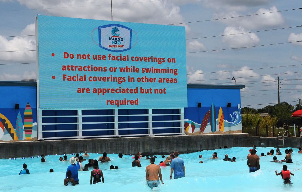 People visit the wave pool at Island H2O Live! water park in Kissimmee, Florida, on Saturday.