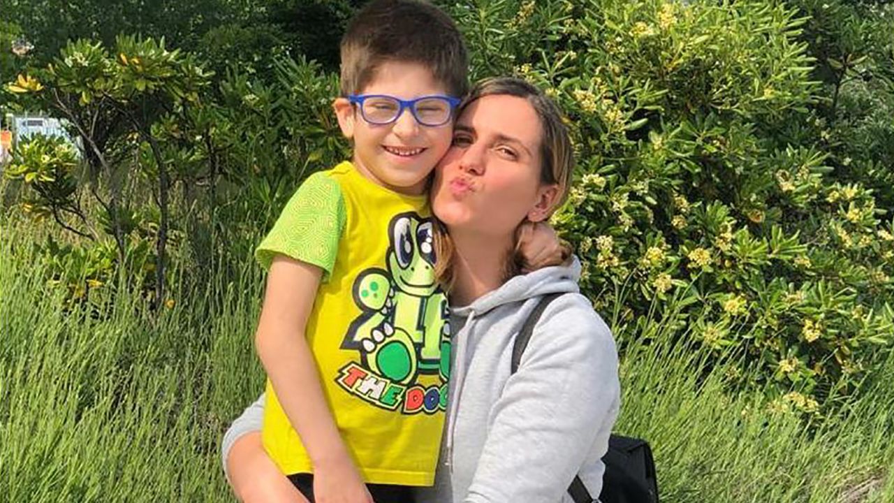 Nicolo poses with his mother Valentina after his recovery.
