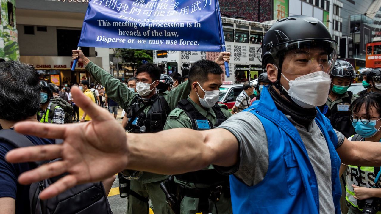 Police tell pro-democracy protesters gathered in Causeway Bay district of Hong Kong to leave on May 24, 2020, ahead of planned protests against a proposal to enact new security legislation in Hong Kong.