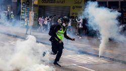 TOPSHOT - Police fire tear gas on protesters during a planned protests against a proposal to enact a new security legislation in Hong Kong on May 24, 2020. - The proposed legislation is expected to ban treason, subversion and sedition, and follows repeated warnings from Beijing that it will no longer tolerate dissent in Hong Kong, which was shaken by months of massive, sometimes violent anti-government protests last year. (Photo by ISAAC LAWRENCE / AFP) (Photo by ISAAC LAWRENCE/AFP via Getty Images)