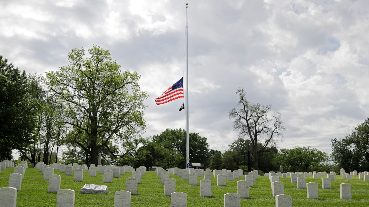 An American flag flies at half-staff at the Crown Hill National Cemetery in Indianapolis.