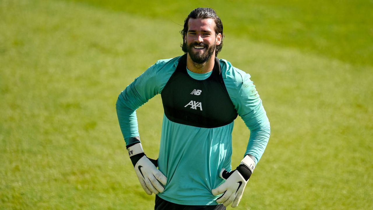 Alisson sports some impressive lockdown locks on his return to training.
