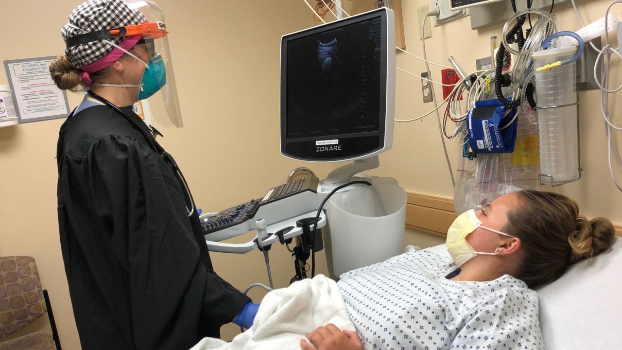 Health care worker wears a gown donated by Gowns 4 Good at University of Vermont Medical Center.