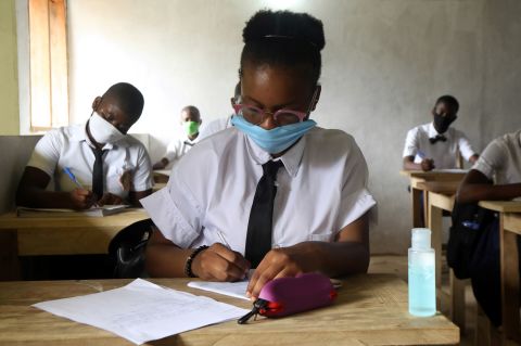 Students in Abidjan, Ivory Coast, study at the Merlan school of Paillet on May 25.