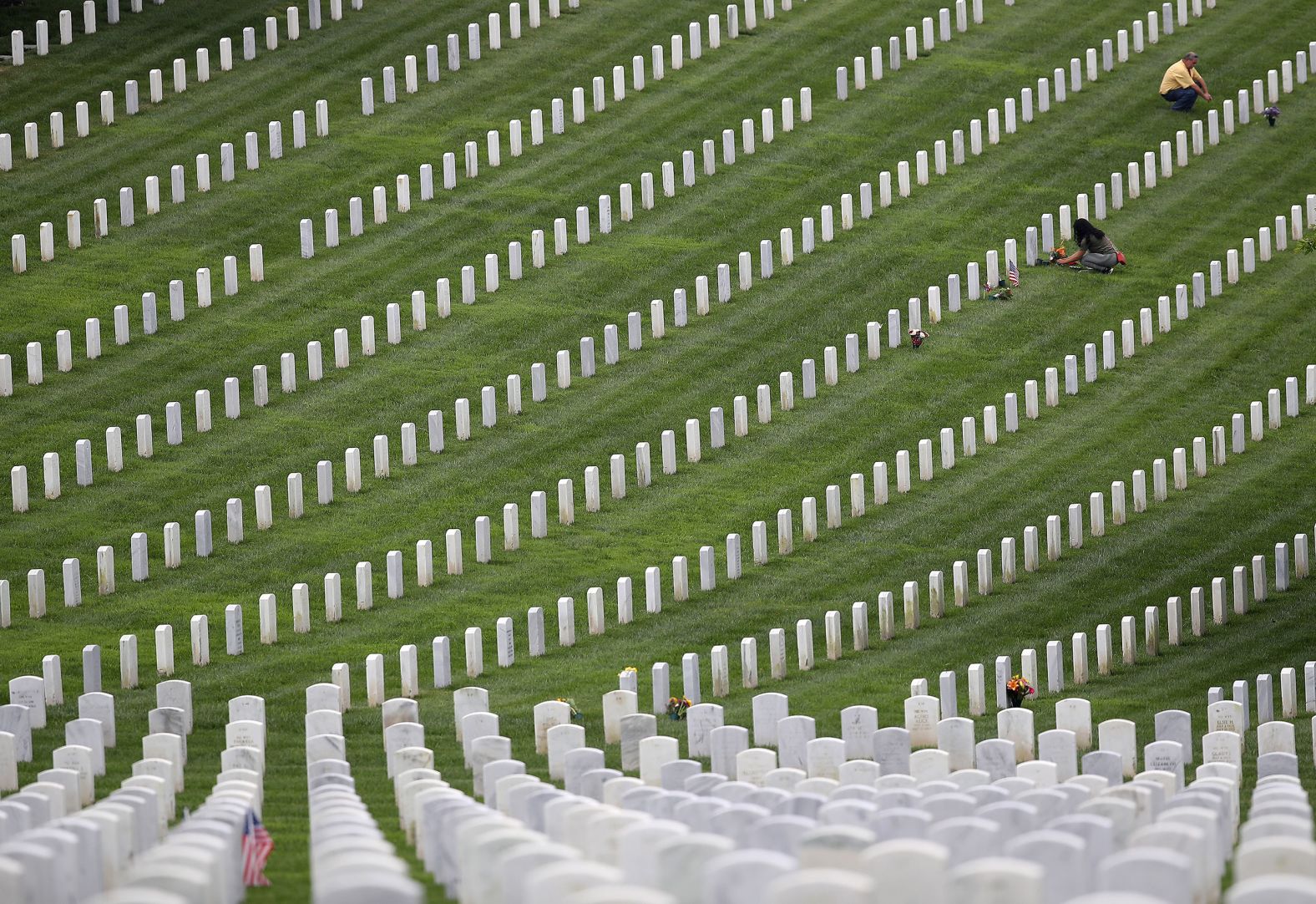 Visitors pay respects at Fort Rosecrans National Cemetery in San Diego on Monday.