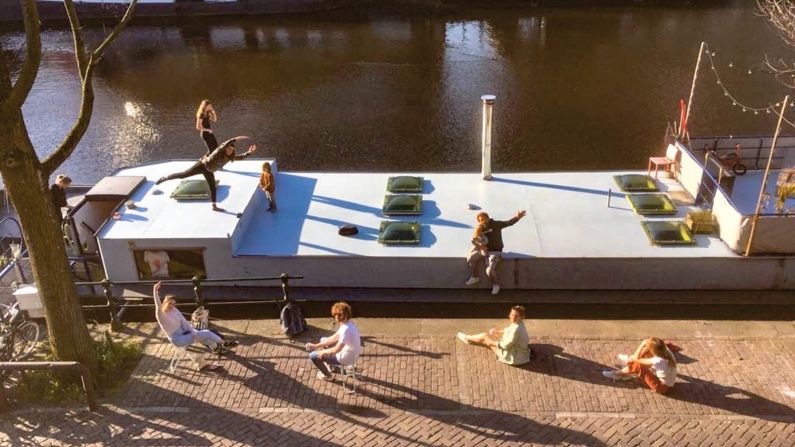 "I have more contact with my neighbors, the canals are clearer than ever and the city's nature is thriving," says Mathys van Abbe, who lives close to the city's red-light district, on the houseboat pictured here. "The constant noise is gone and there is calmness. Amsterdam has a circadian rhythm again. It feels like a little retreat."