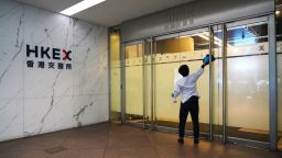 A cleaner disinfects a door of HKEX (Hong Kong Stock Exchange) Connect Hall on March 27, 2020 in Hong Kong, China.