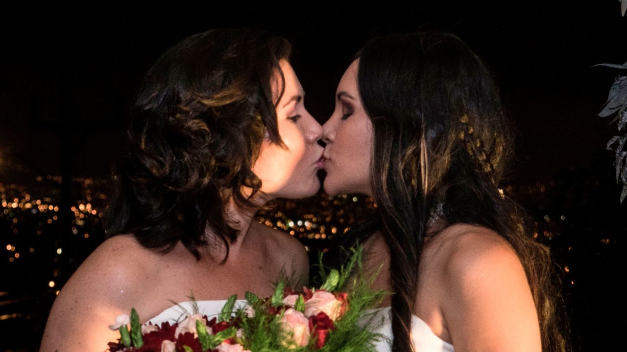 Alexandra Quiros and Dunia Araya kiss during their wedding Tuesday in Costa Rica.