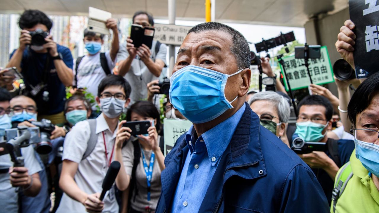 Hong Kong media tycoon and founder of Apple Daily newspaper Jimmy Lai (C) arrives at the West Kowloon Magistrates Court for charges related to last year's protests in Hong Kong on May 18, 2020. - Some of Hong Kong's most prominent pro-democracy activists were charged on May 18 for taking part in last year's huge protests, hours after clashes erupted in the legislature as the city lurches back into a political crisis. (Photo by Anthony WALLACE / AFP) (Photo by ANTHONY WALLACE/AFP via Getty Images)