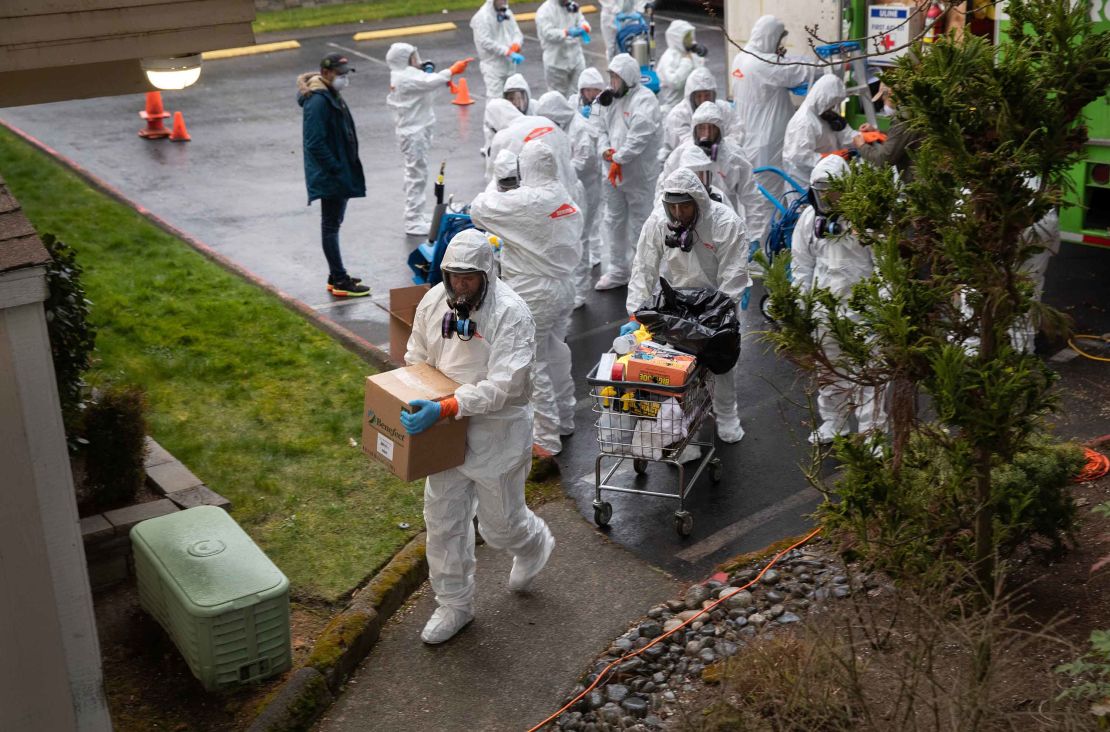 A cleaning crew enters the Life Care Center on the outskirts of Seattle, Washington on March 12.