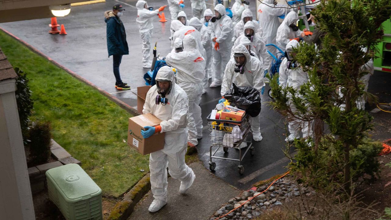 A cleaning crew enters the Life Care Center on the outskirts of Seattle, Washington on March 12.
