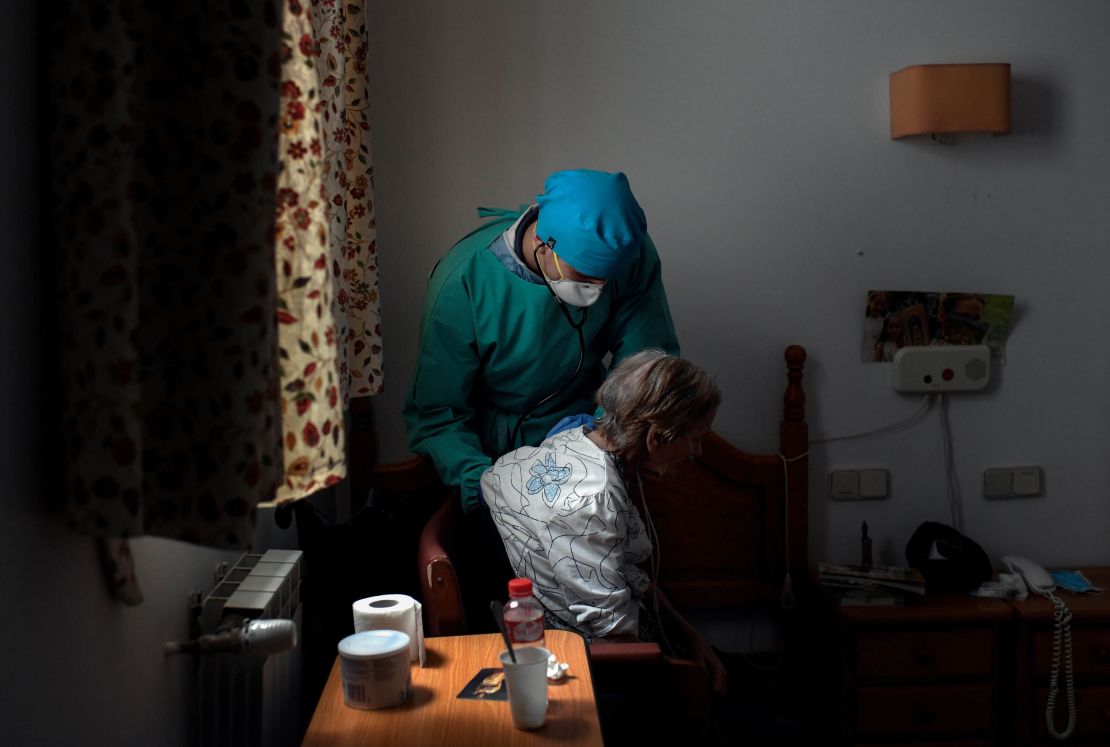 A doctor examines an isolated resident at a nursing home in Madrid, Spain on April 24.  
