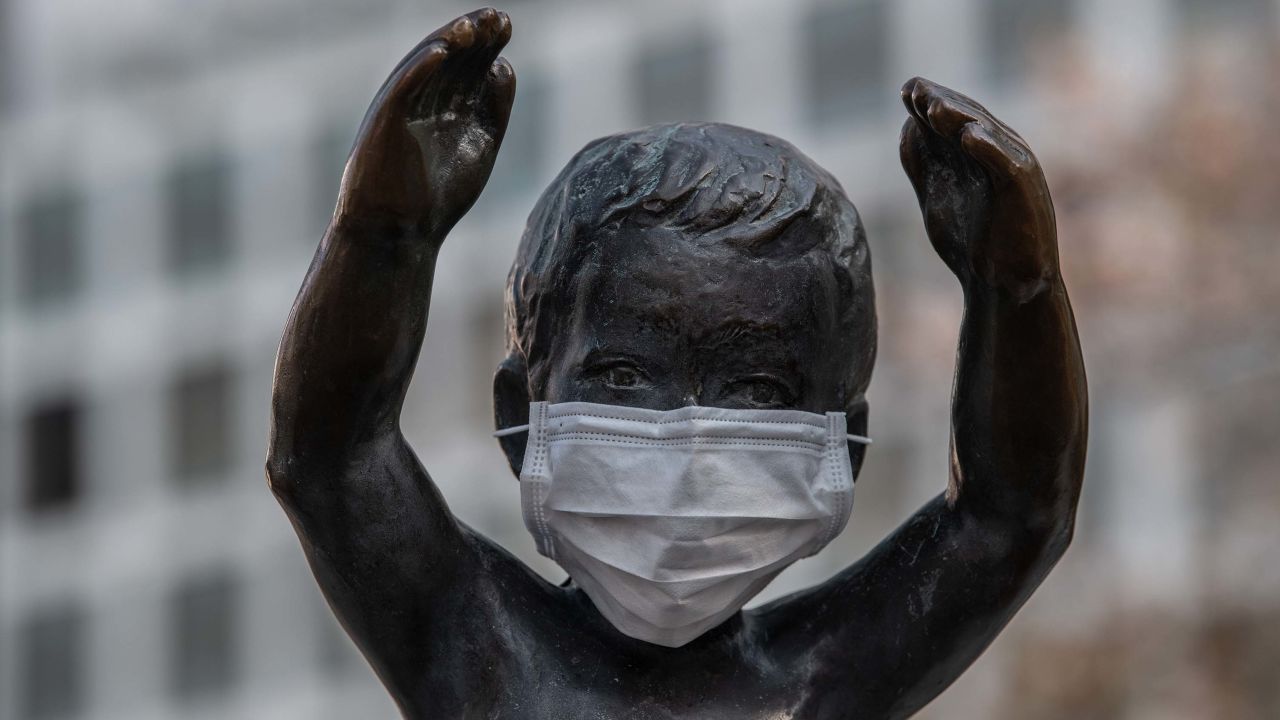A statue of a small boy is pictured with a face mask on April 8, 2020 in Tokyo, Japan.