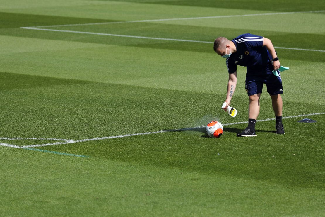 A English Premier League Nike Ball is sprayed with disinfectant during a training session at Sir Jack Hayward Training Ground on May 20 in Wolverhampton, England.