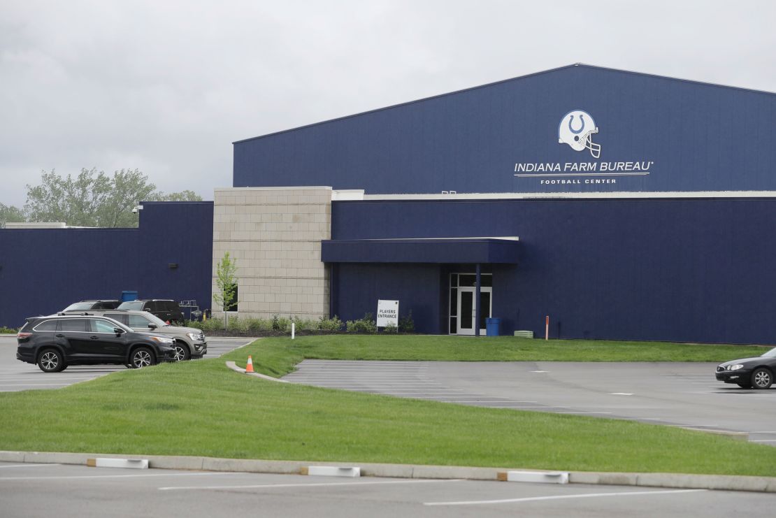 A parking lot is nearly empty in front of the Indianapolis Colts training facility on May 19 in Indianapolis. Coaching staffs and all players except those undergoing injury rehabilitation are barred from the facilities in the first phase of the league's plan. 