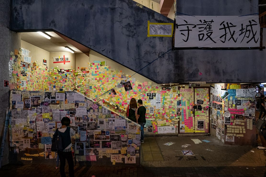 A "Lennon wall" in Sai Wan Ho district on July 20, 2019 in Hong Kong.  Inspired from the Lennon wall of Prague, the origins of Hong Kong's Lennon wall dates back to the 2014 Umbrella Movement, when protesters covered a wall outside government headquarters with Post-it notes expressing their frustrations and aspirations. 