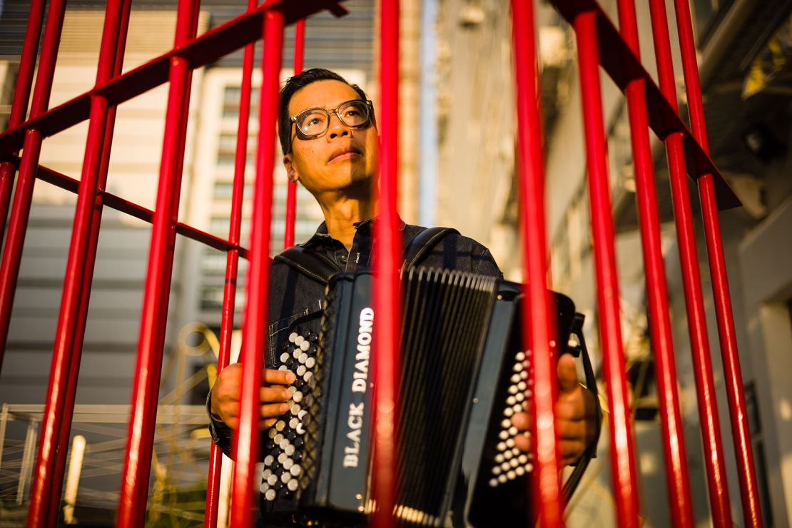 Kacey Wong inside a red mobile prison artwork called "The Patriot," a performance art project protesting a proposed law to criticize disrespecting China's national anthem in December 2018. Throughout his career, he has consistently created political artworks.