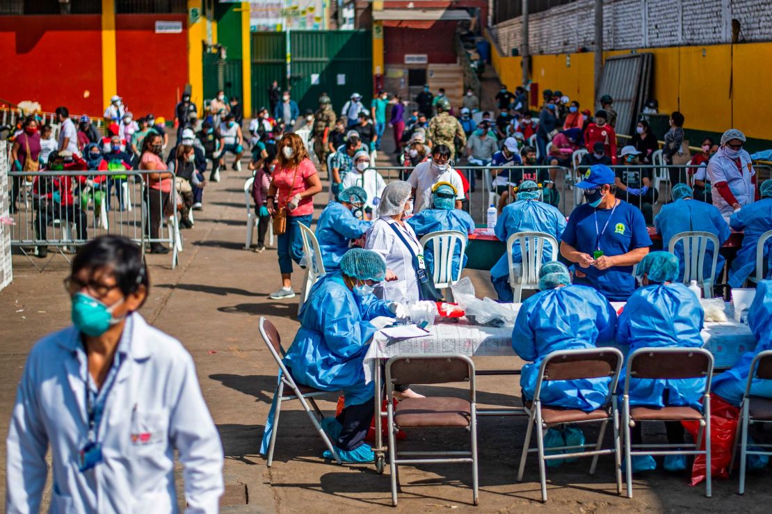 Health Ministry workers prepare to carry out coronavirus tests for employees of the Ciudad de Dios market in Lima, Peru on May 11.