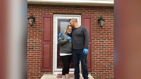 Amanda Stone and Scott Maraldo in front of the home they bought that Scott had never visited.