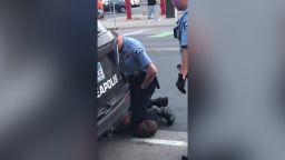 A video that circulated on social media showed two officers by the man on the ground -- one of them had his knee over the back of the man's neck.