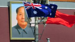 The national flags of Australia and China are displayed before a portrait of Mao Zedong facing Tiananmen Square, during a visit by Australia's Prime Minister Julia Gillard in Beijing on April 26, 2011. The trip is Gillard's first to China, Australia's top trading partner, and comes at a time when the communist country is waging its toughest crackdown on dissent in years. AFP PHOTO/Frederic J. BROWN (Photo credit should read FREDERIC J. BROWN/AFP via Getty Images)