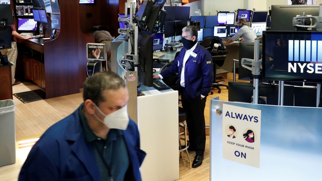 Traders work on the floor of the New York Stock Exchange after it reopened for in-person trading on May 26.