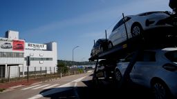 A car carrier transporting Renault cars leaves the Flins plant of French carmaker Renault in Aubergenville, west of Paris, Monday, May 25, 2020. (AP Photo/Christophe Ena)