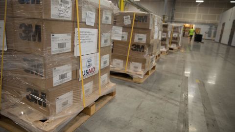 Boxes of personal protective equipment (PPE) is delivered to a warehouse to be distributed by the Oregon Army National Guard. The shipment was coordinated by FEMA to deliver supplies stored in Dubai by USAID.